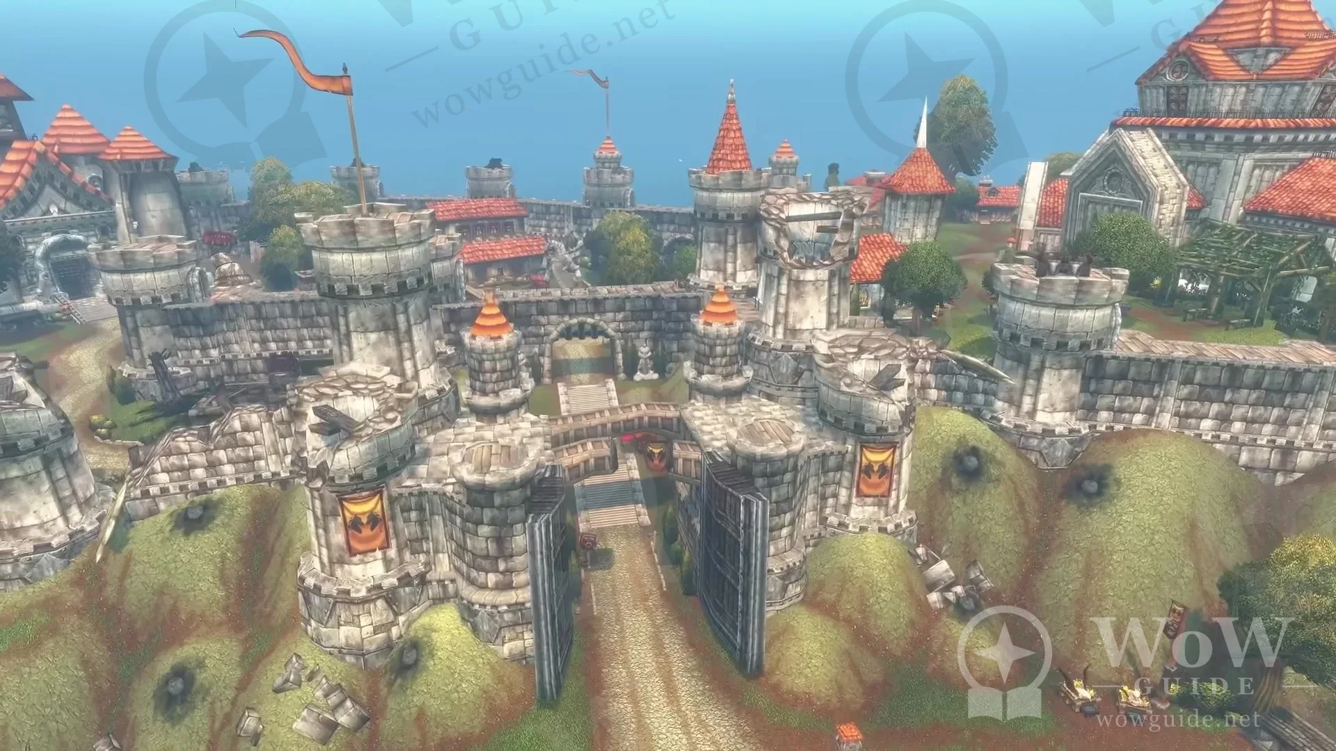 Aerial view of a large human city with red-roofed towers and walls