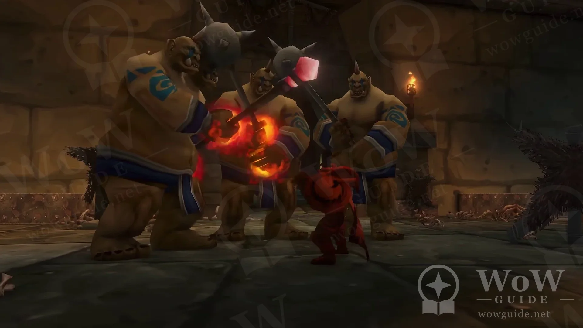Taş bir zindanda kırmızı zırhlı küçük bir Warrior sopalı üç ogre'yi tutuyor, bir ogre'nin silahında alev parlıyor