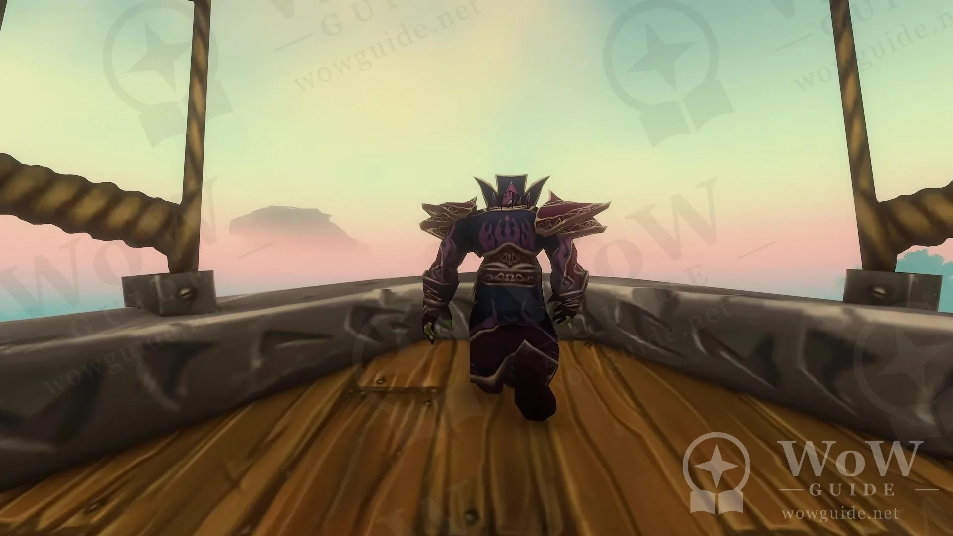 An armoured character standing on an airship deck overlooking a hazy landscape